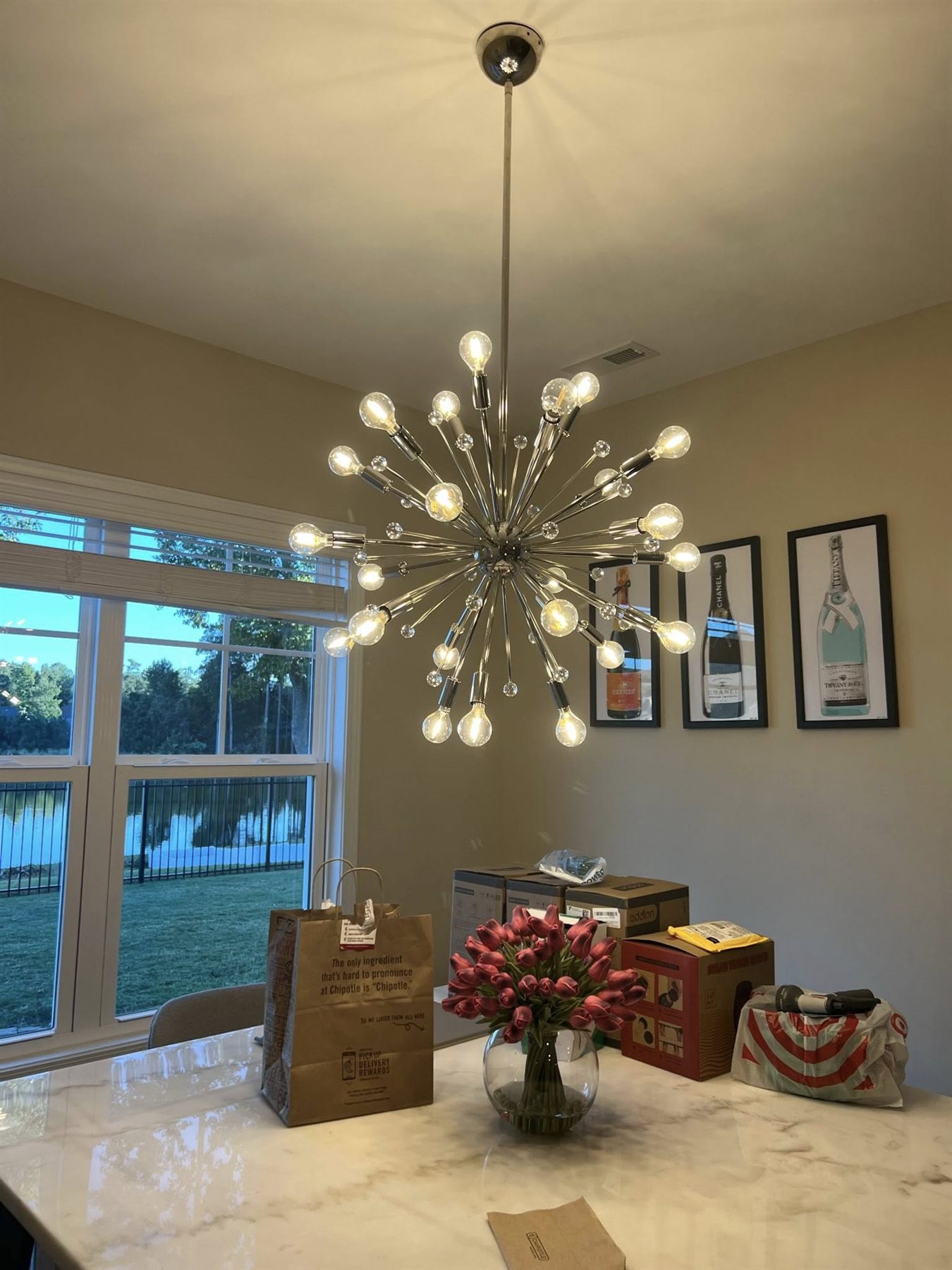 Modern sputnik chandelier installed on a vaulted ceiling