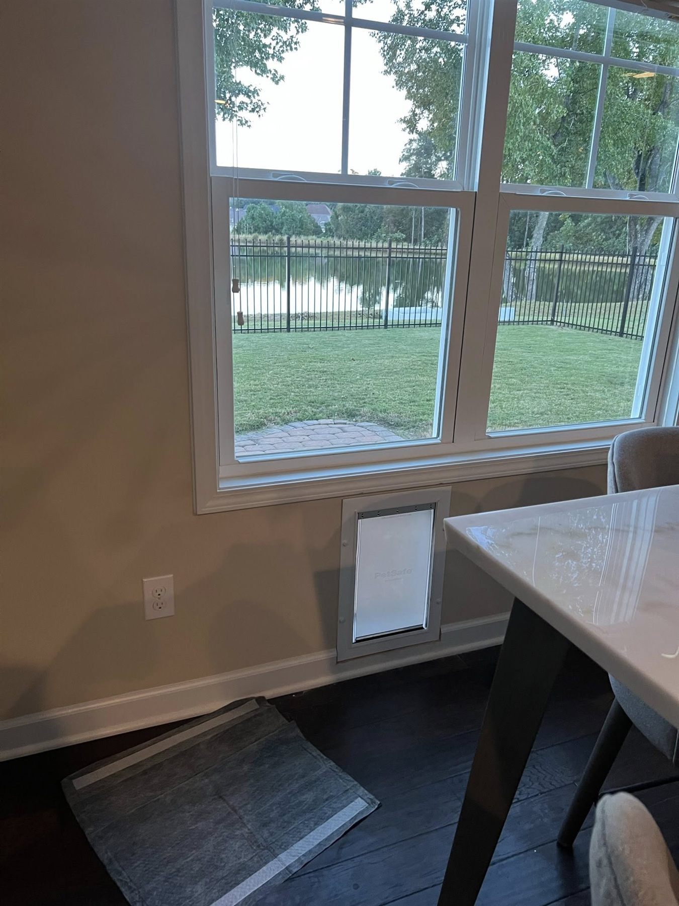 Pet door installed cleanly through a dining room wall
