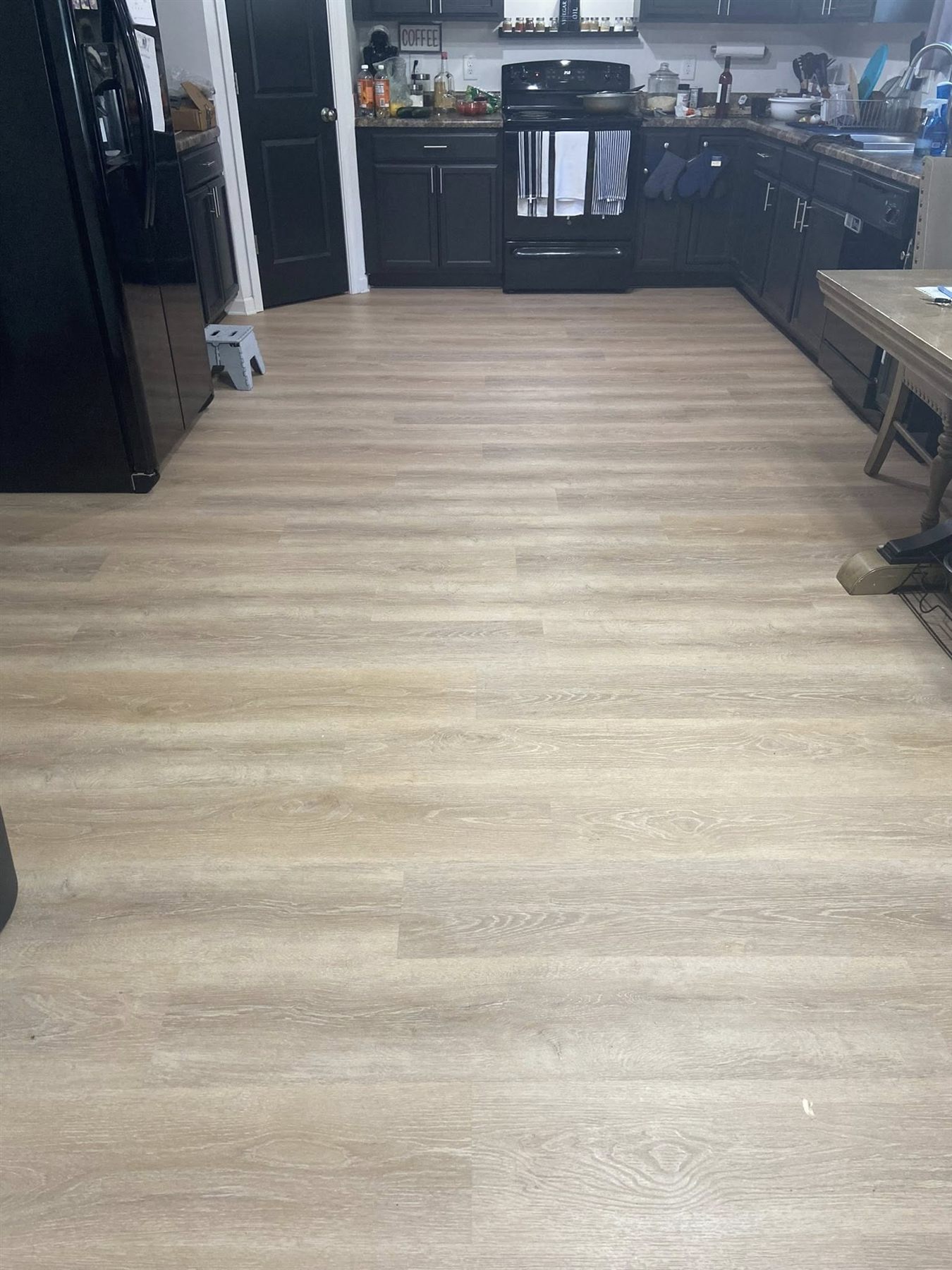 Kitchen with new light oak luxury vinyl plank flooring